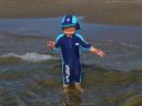 Morgan paddling in the sea at Borth
