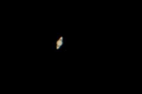 Saturn with two moons just visible Saturn with two moons just visible