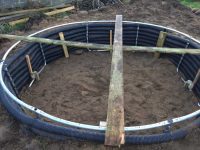 Reinforced retaining wall