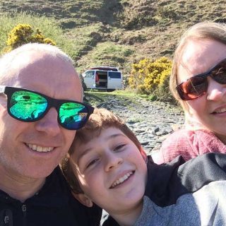 Family Selfie with Ramsey the Camper in the background