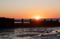 Sunset behind the groynes